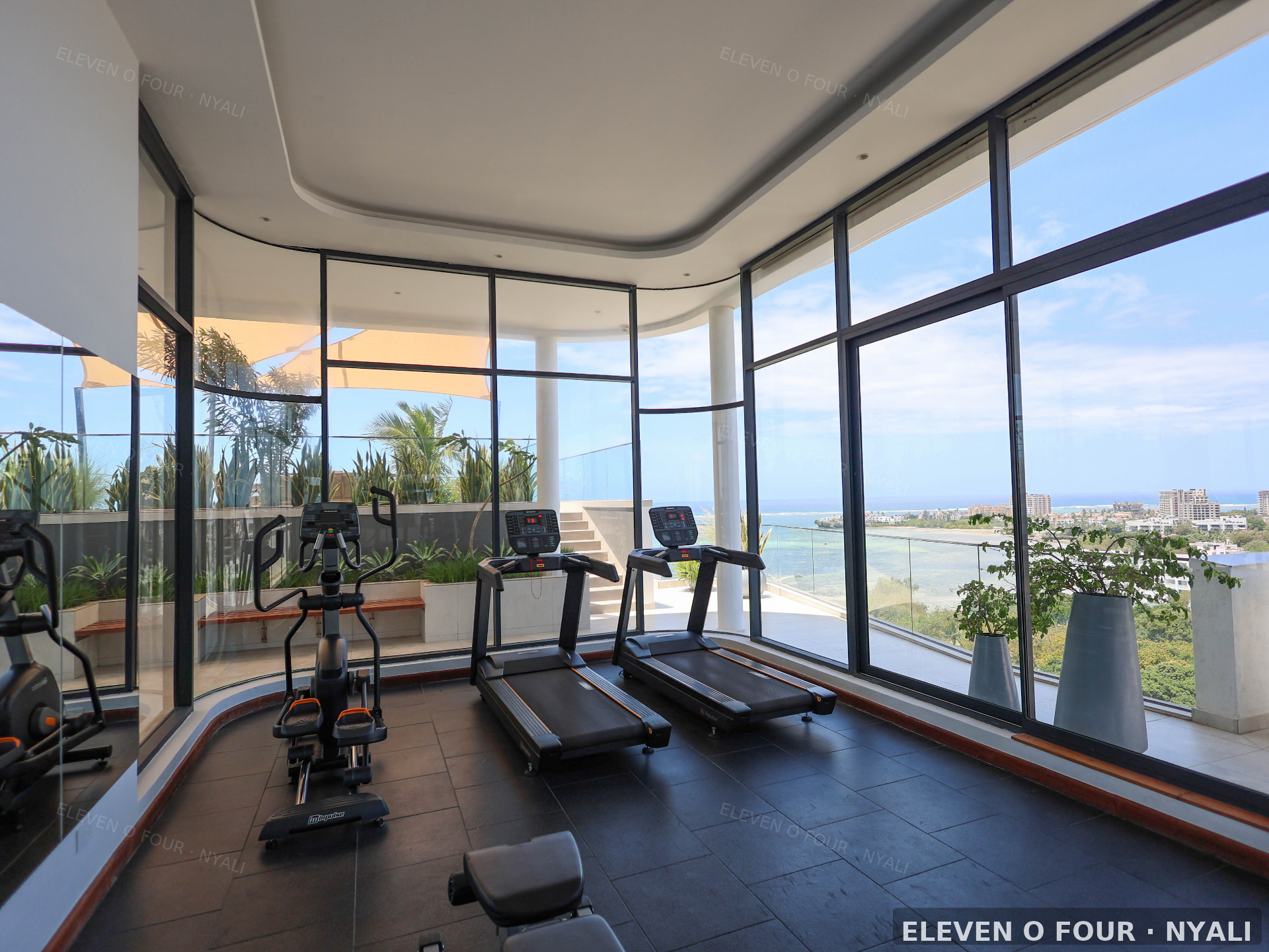 Rooftop gym with panoramic ocean views